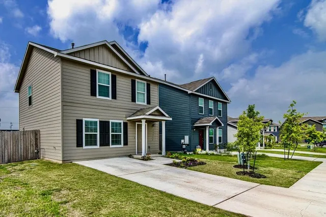 a front view of a house with a yard