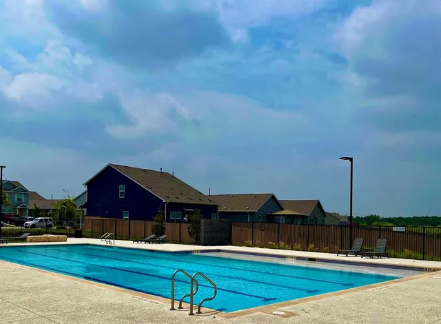 a house view with a sitting space and garden space