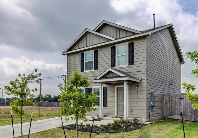 a front view of a house with garden