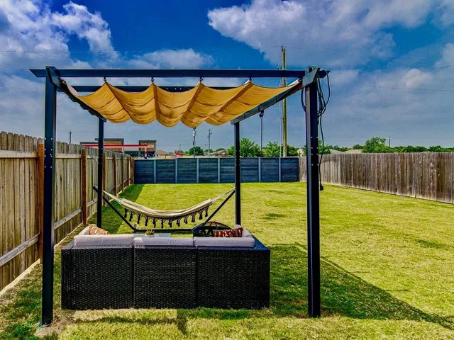 a view of swimming pool with furniture