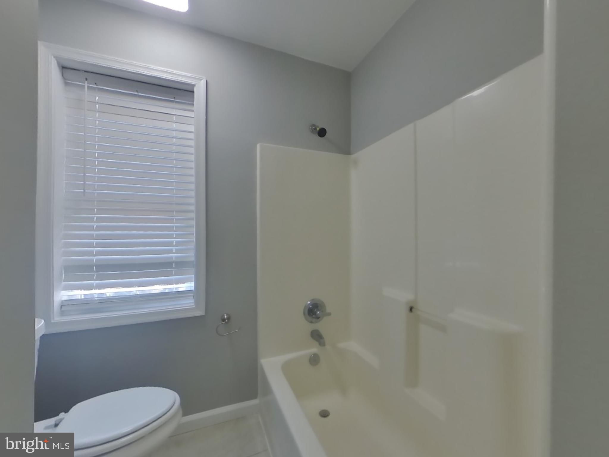 1614 Thomas Road Fort Washington, MD 20744 - Photo 11 of 20 a white bath tub sitting next to a toilet