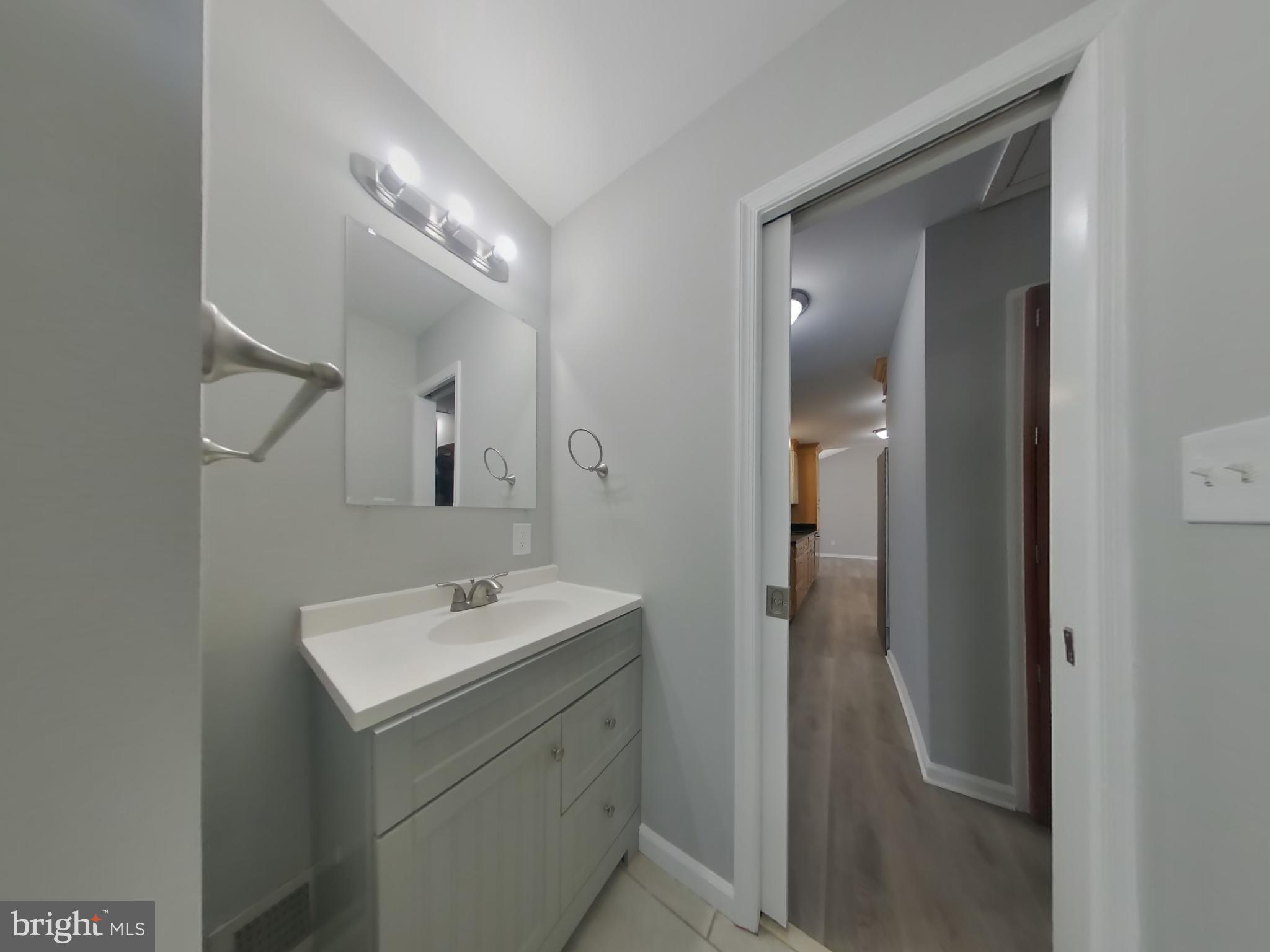 1614 Thomas Road Fort Washington, MD 20744 - Photo 12 of 20 a bathroom with a sink and mirror