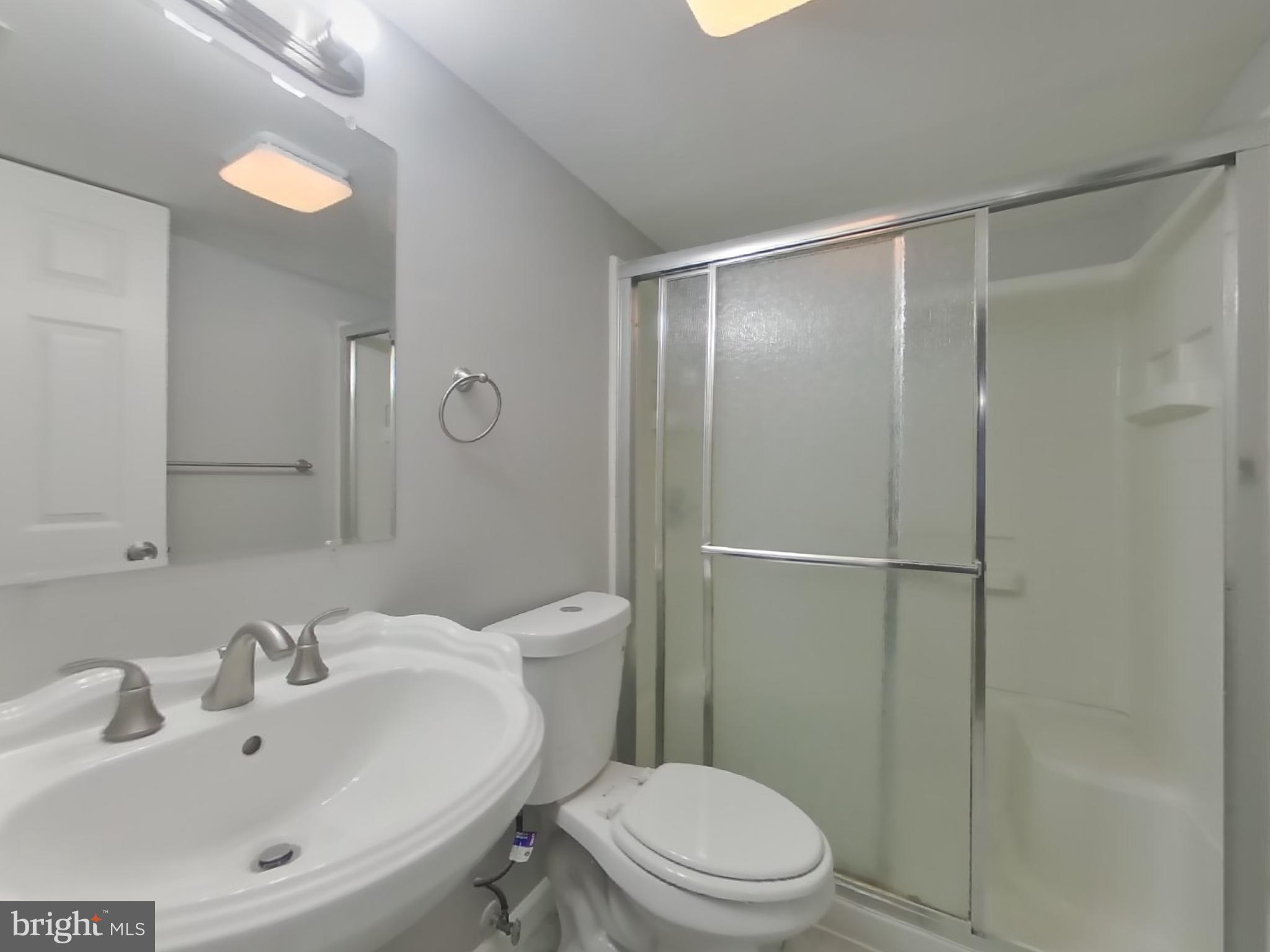 1614 Thomas Road Fort Washington, MD 20744 - Photo 13 of 20 a bathroom with a sink toilet and shower