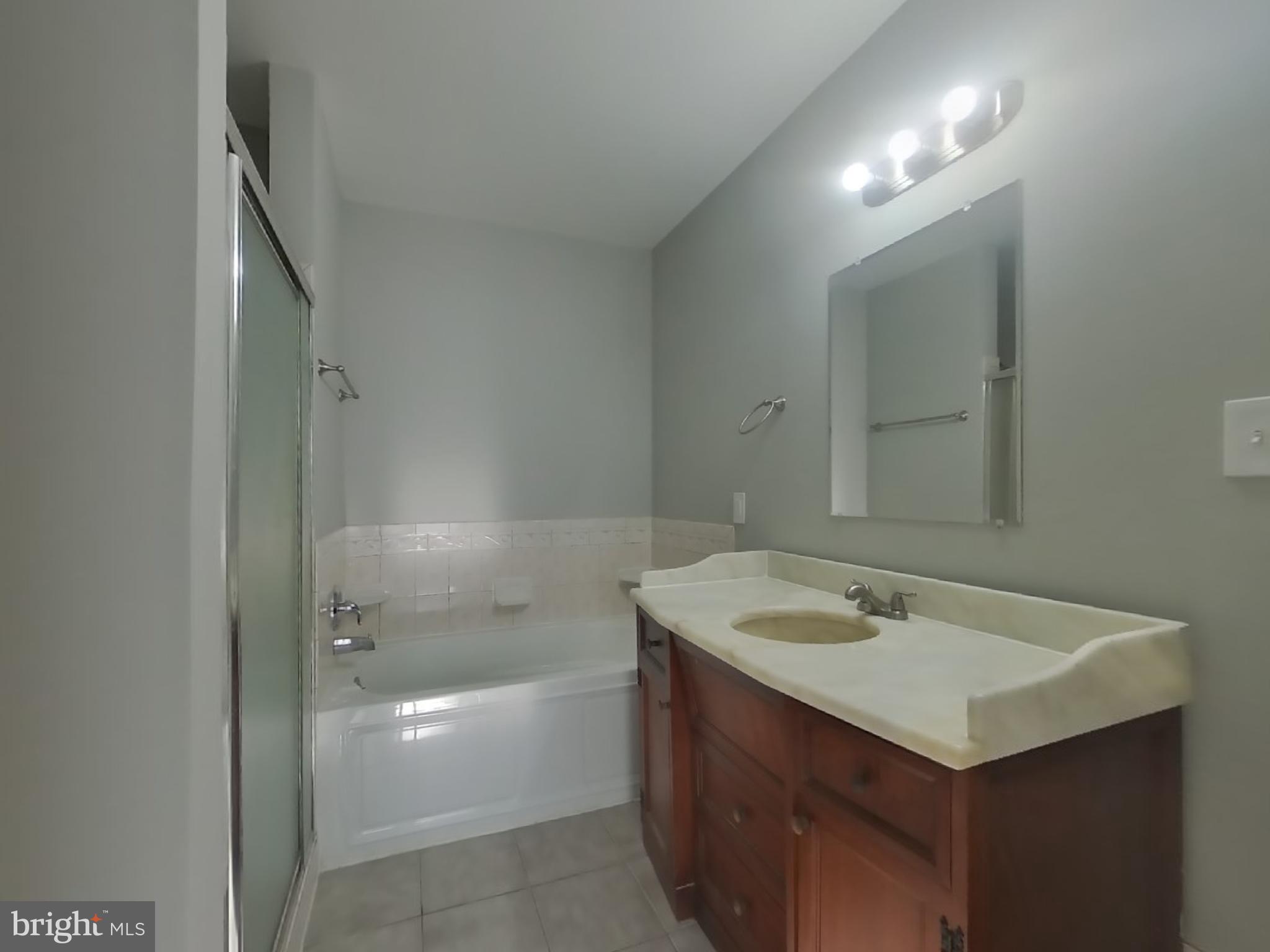 1614 Thomas Road Fort Washington, MD 20744 - Photo 7 of 20 a bathroom with a sink and a mirror