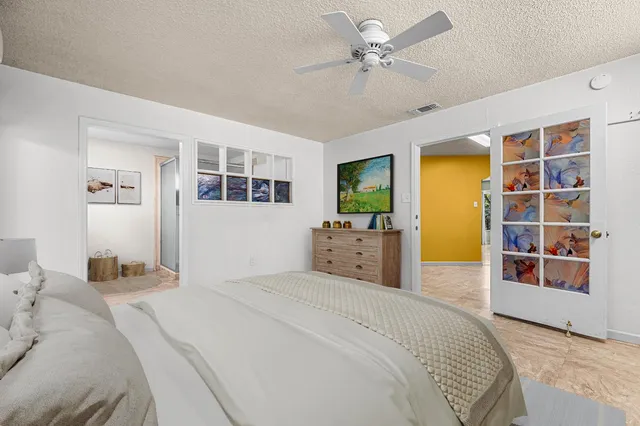a view of an empty room with a ceiling fan