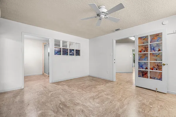 a bedroom with a bed and a couch