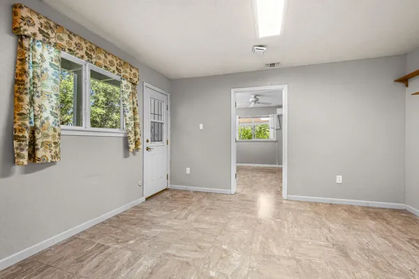 a kitchen with a sink and a mirror