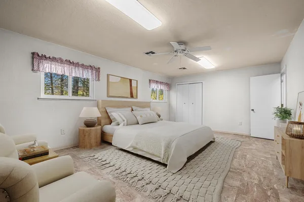 a view of a yard with a house and a large tree