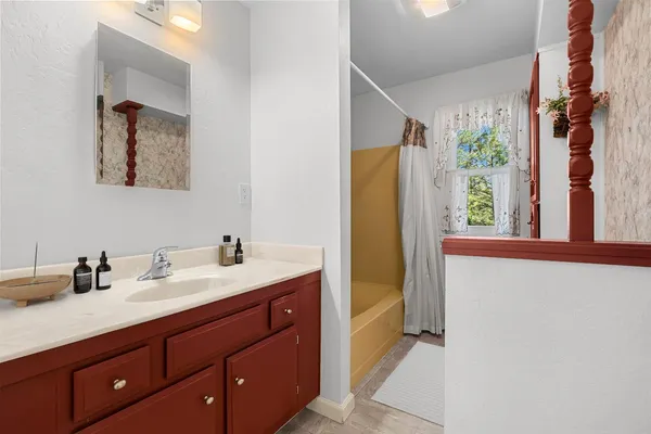 a backyard of a house with lots of green space and garden