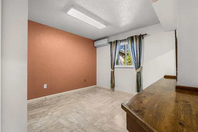 a view of a field with a mountain in the background