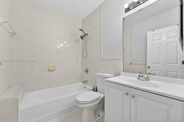 a view of room with wooden floor