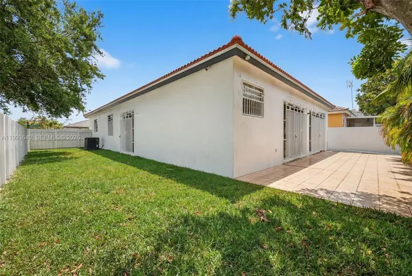 a front view of house with a yard and garage