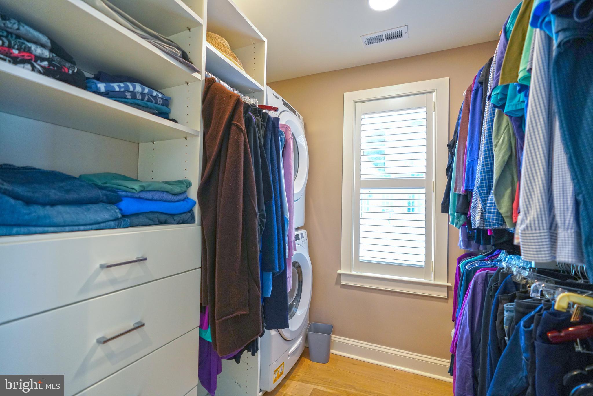 410 Pilottown Road Lewes, DE 19958 - Photo 57 of 114 a view of walk in closet with clothes and shoes