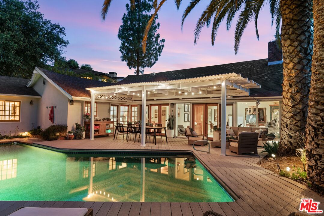 16355 Mandalay Drive Encino, CA 91436 - Photo 1 of 45 a view of a house with swimming pool patio and sitting area