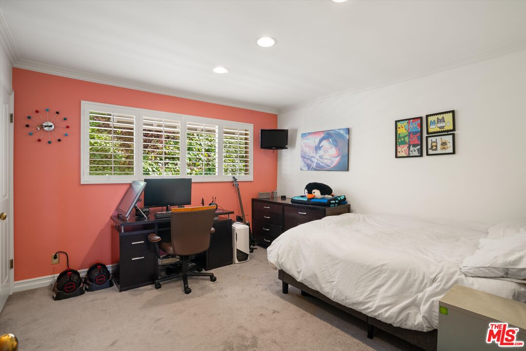 16355 Mandalay Drive Encino, CA 91436 - Photo 15 of 45 a bedroom with a bed and a desk