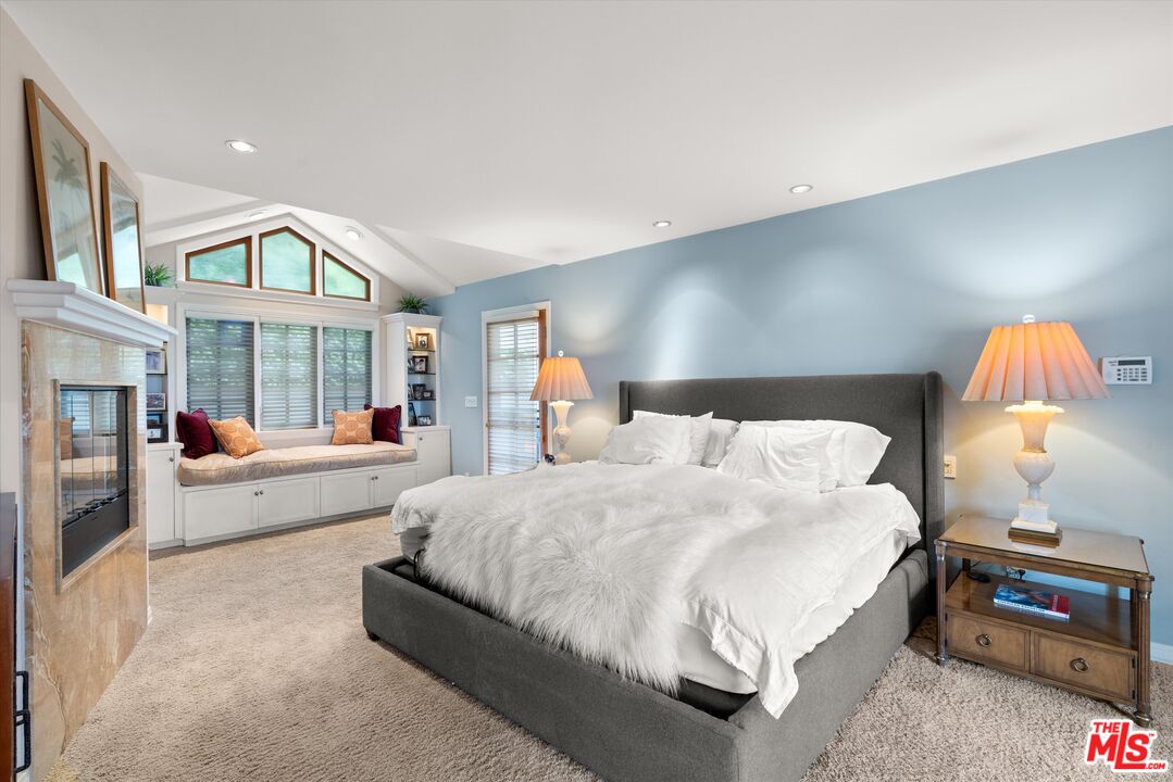 16355 Mandalay Drive Encino, CA 91436 - Photo 19 of 45 a spacious bedroom with a bed and a window