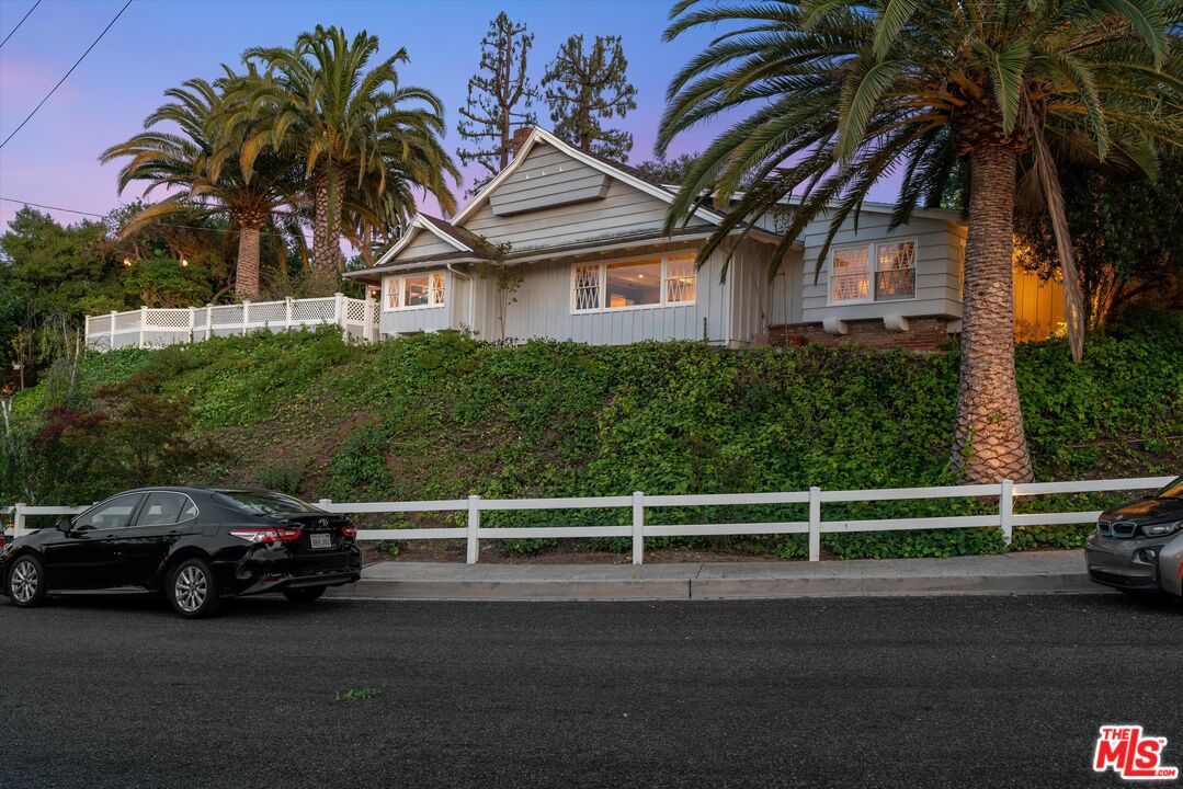 16355 Mandalay Drive Encino, CA 91436 - Photo 2 of 45 a view of a car parked on the side of the road