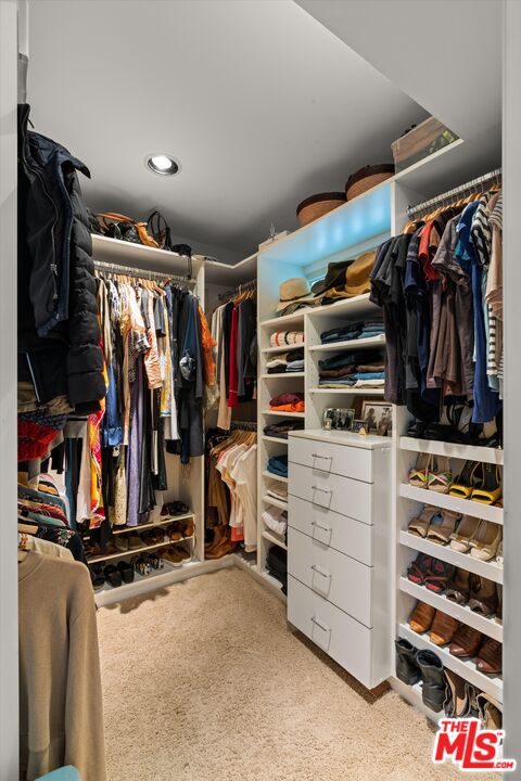 16355 Mandalay Drive Encino, CA 91436 - Photo 23 of 45 a view of walk in closet with clothes and shoes