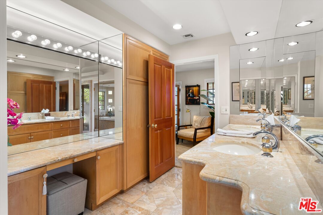 16355 Mandalay Drive Encino, CA 91436 - Photo 25 of 45 a large kitchen with kitchen island a sink and a large window