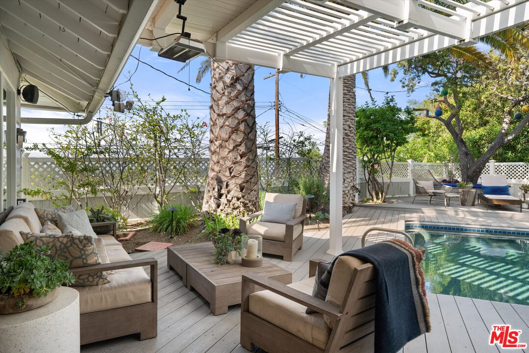16355 Mandalay Drive Encino, CA 91436 - Photo 28 of 45 a view of a patio with couches table and chairs and potted plants
