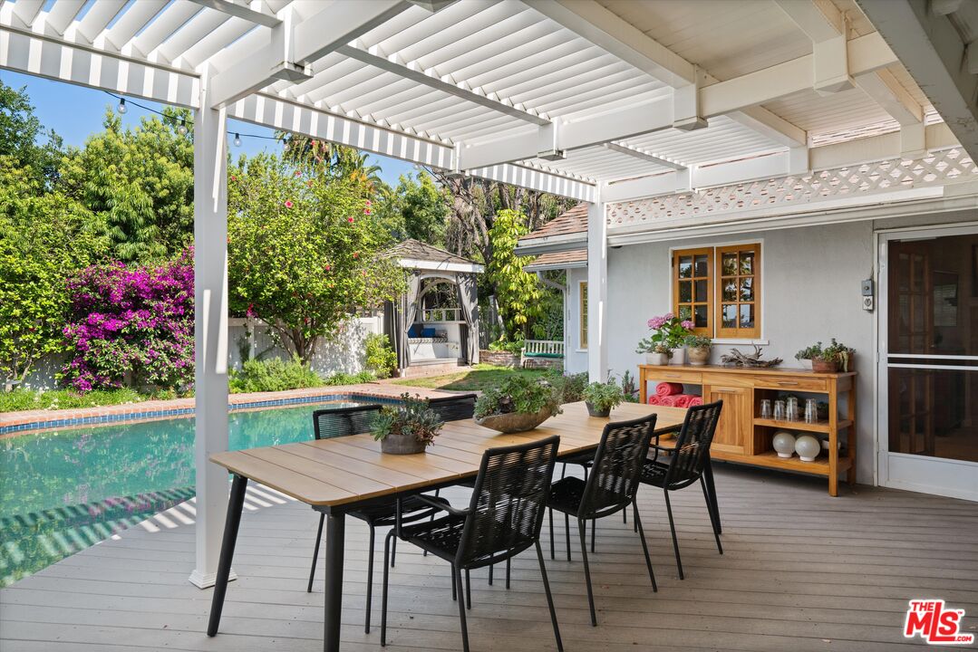 16355 Mandalay Drive Encino, CA 91436 - Photo 30 of 45 a view of an outside dining space with furniture window
