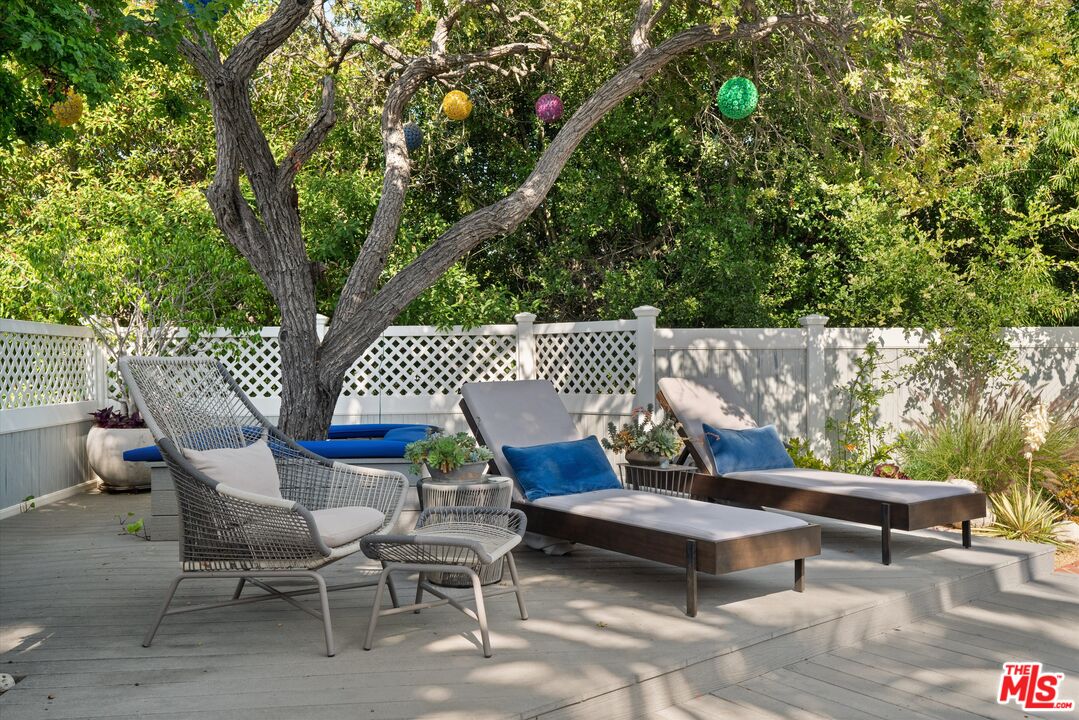 16355 Mandalay Drive Encino, CA 91436 - Photo 31 of 45 a view of a bench in a backyard