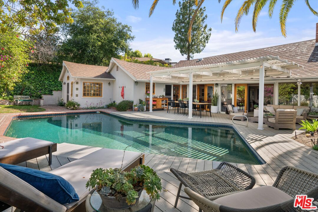 16355 Mandalay Drive Encino, CA 91436 - Photo 32 of 45 a view of house with swimming pool and outdoor seating