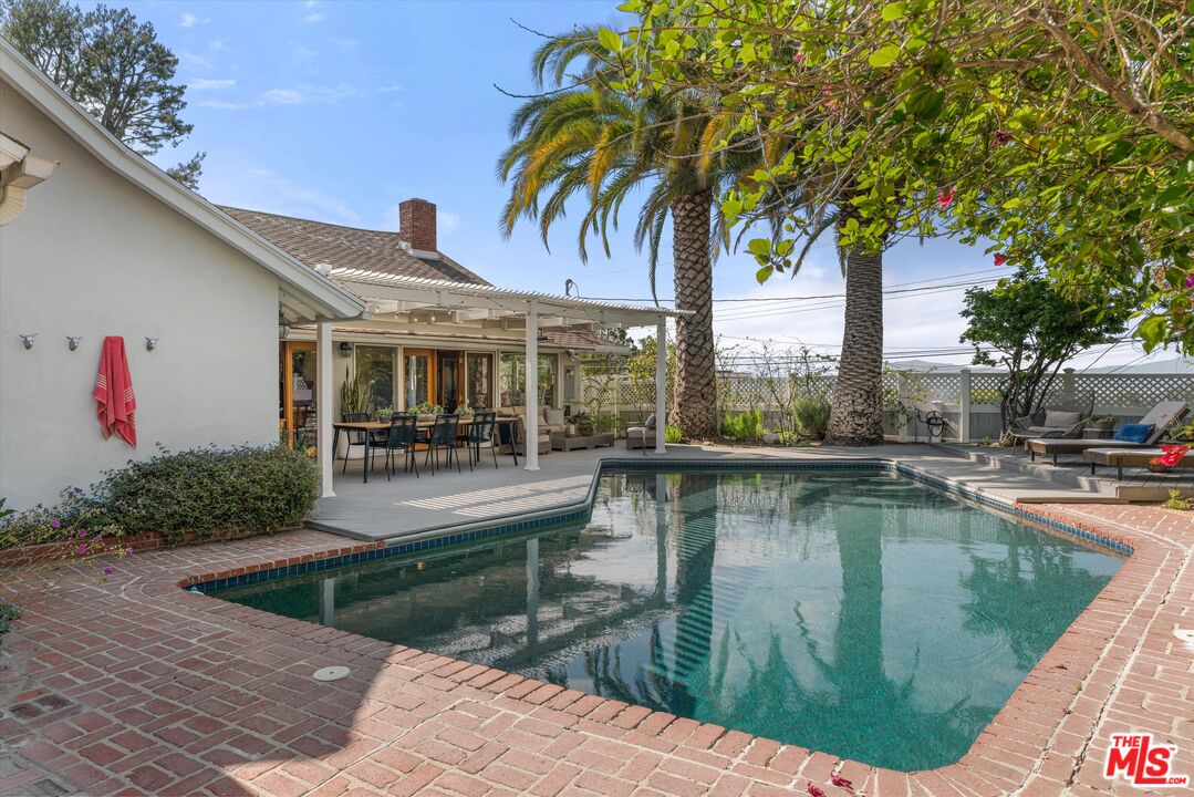 16355 Mandalay Drive Encino, CA 91436 - Photo 33 of 45 a view of a swimming pool with a patio