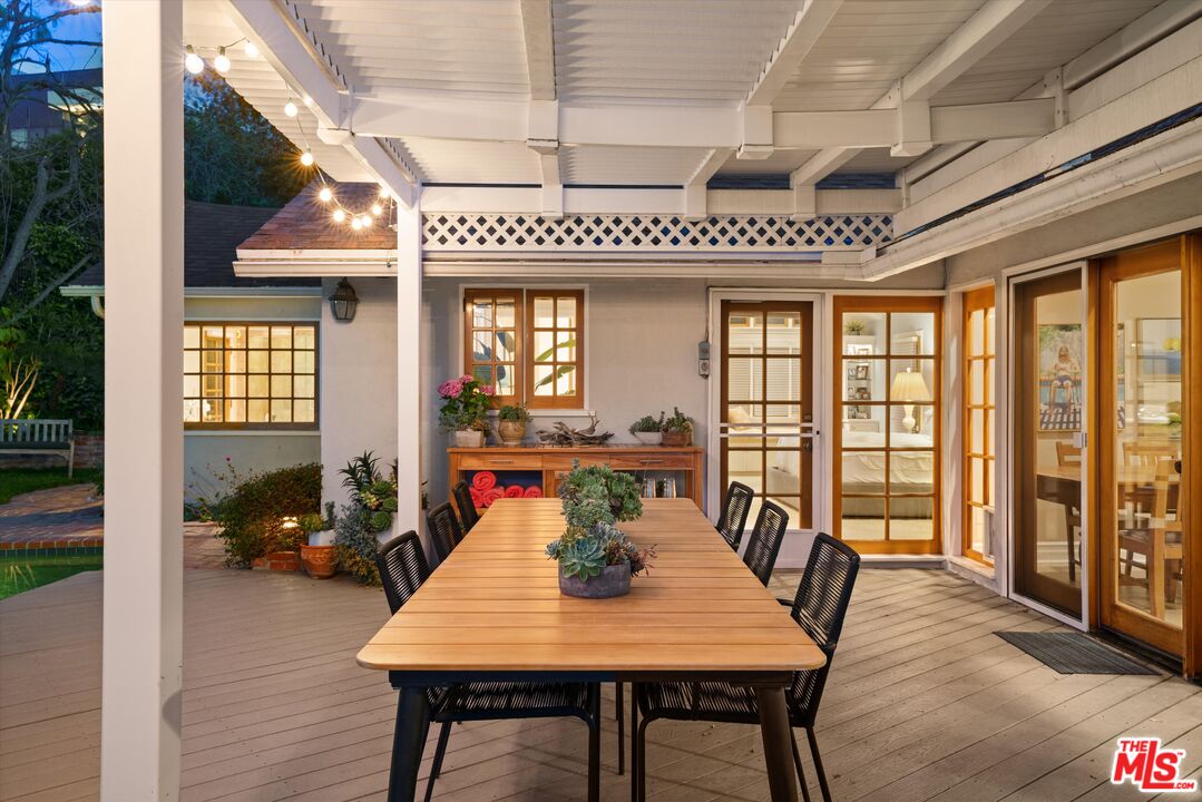 16355 Mandalay Drive Encino, CA 91436 - Photo 35 of 45 a view of a dining room with furniture window and wooden floor