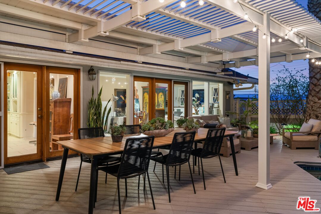 16355 Mandalay Drive Encino, CA 91436 - Photo 36 of 45 a view of a dining room with furniture window and wooden floor