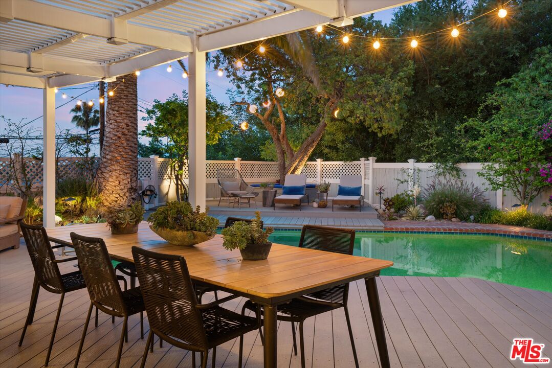 16355 Mandalay Drive Encino, CA 91436 - Photo 37 of 45 a view of a patio with a table and chairs