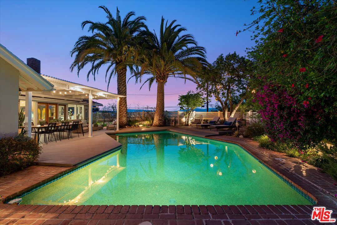 16355 Mandalay Drive Encino, CA 91436 - Photo 40 of 45 a view of a swimming pool with chairs