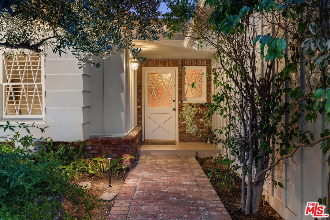 16355 Mandalay Drive Encino, CA 91436 - Photo 4 of 45 a front view of a house with a yard