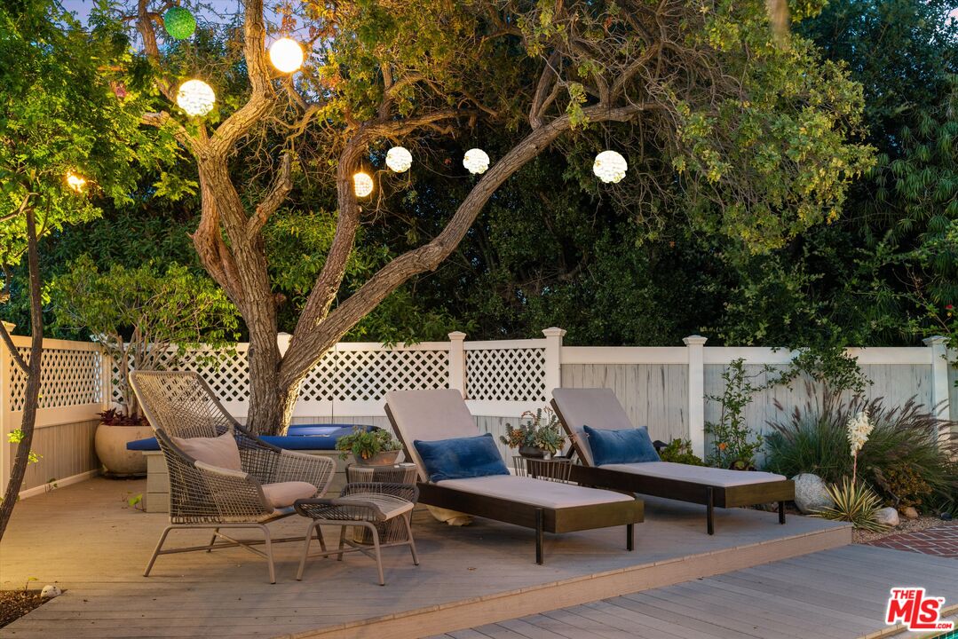 16355 Mandalay Drive Encino, CA 91436 - Photo 42 of 45 a view of a patio with chairs and potted plants