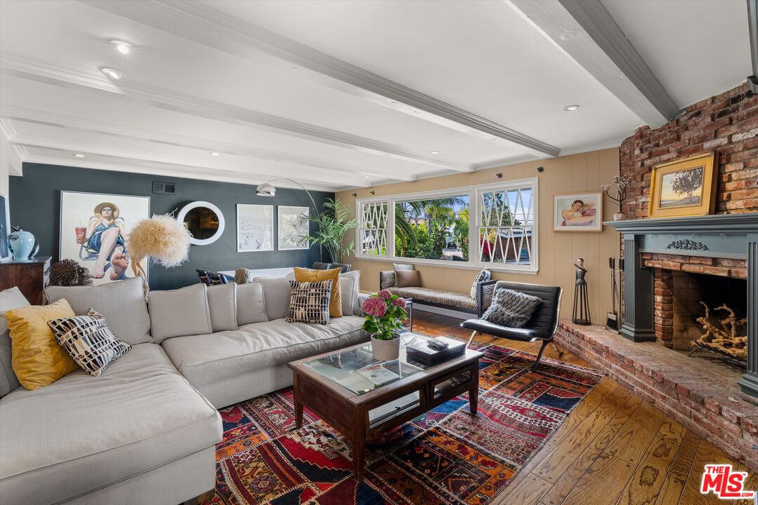 16355 Mandalay Drive Encino, CA 91436 - Photo 7 of 45 a living room with furniture and a fireplace
