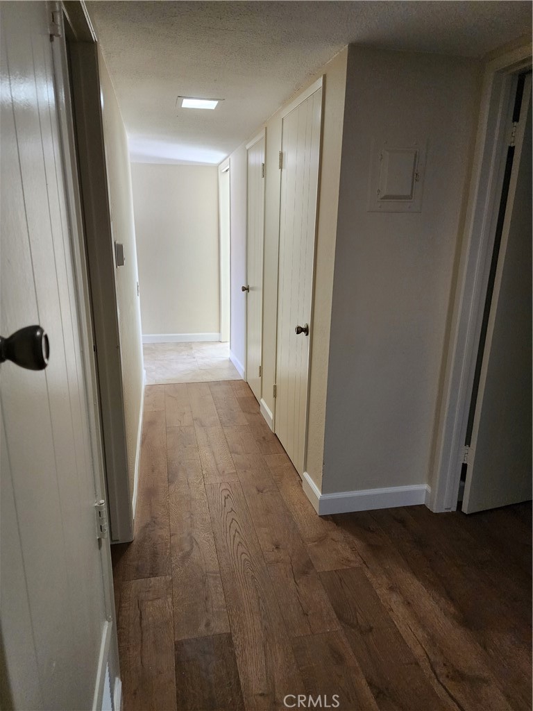 402 West Kelly Avenue, Unit A Orange, CA 92866 - Photo 11 of 13 a view of a hallway with wooden floor