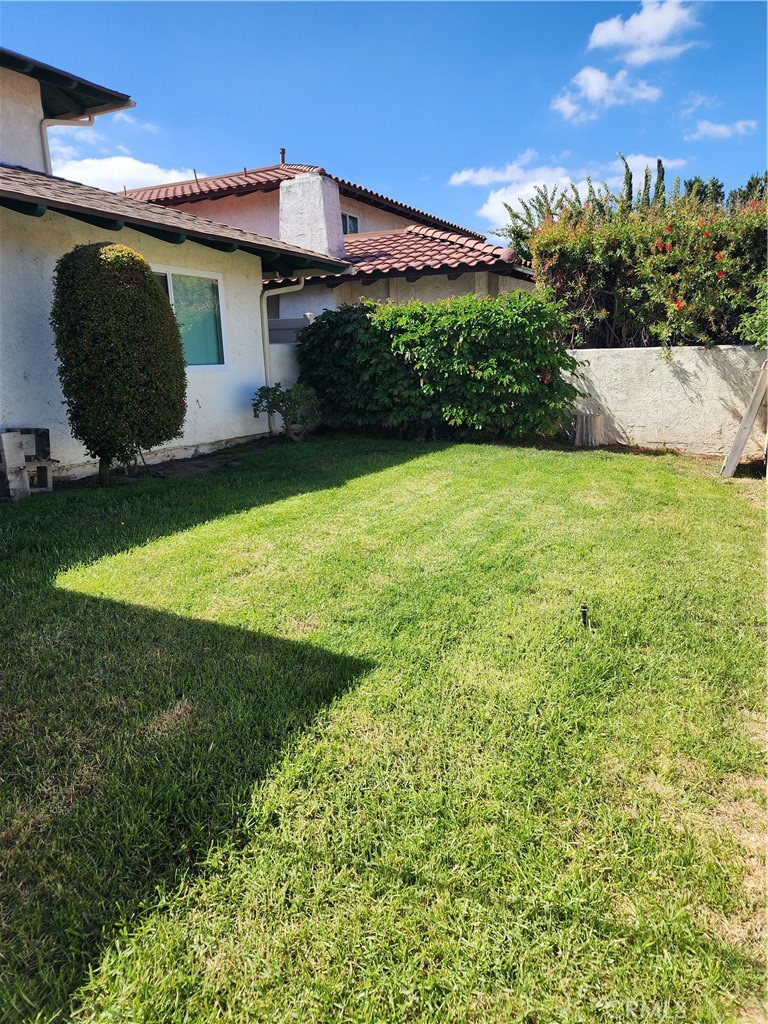 402 West Kelly Avenue, Unit A Orange, CA 92866 - Photo 12 of 13 a front view of a house with garden