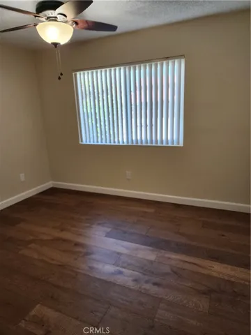 a view of a livingroom with wooden floor