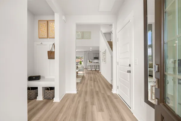 a view of a living room with wooden floor