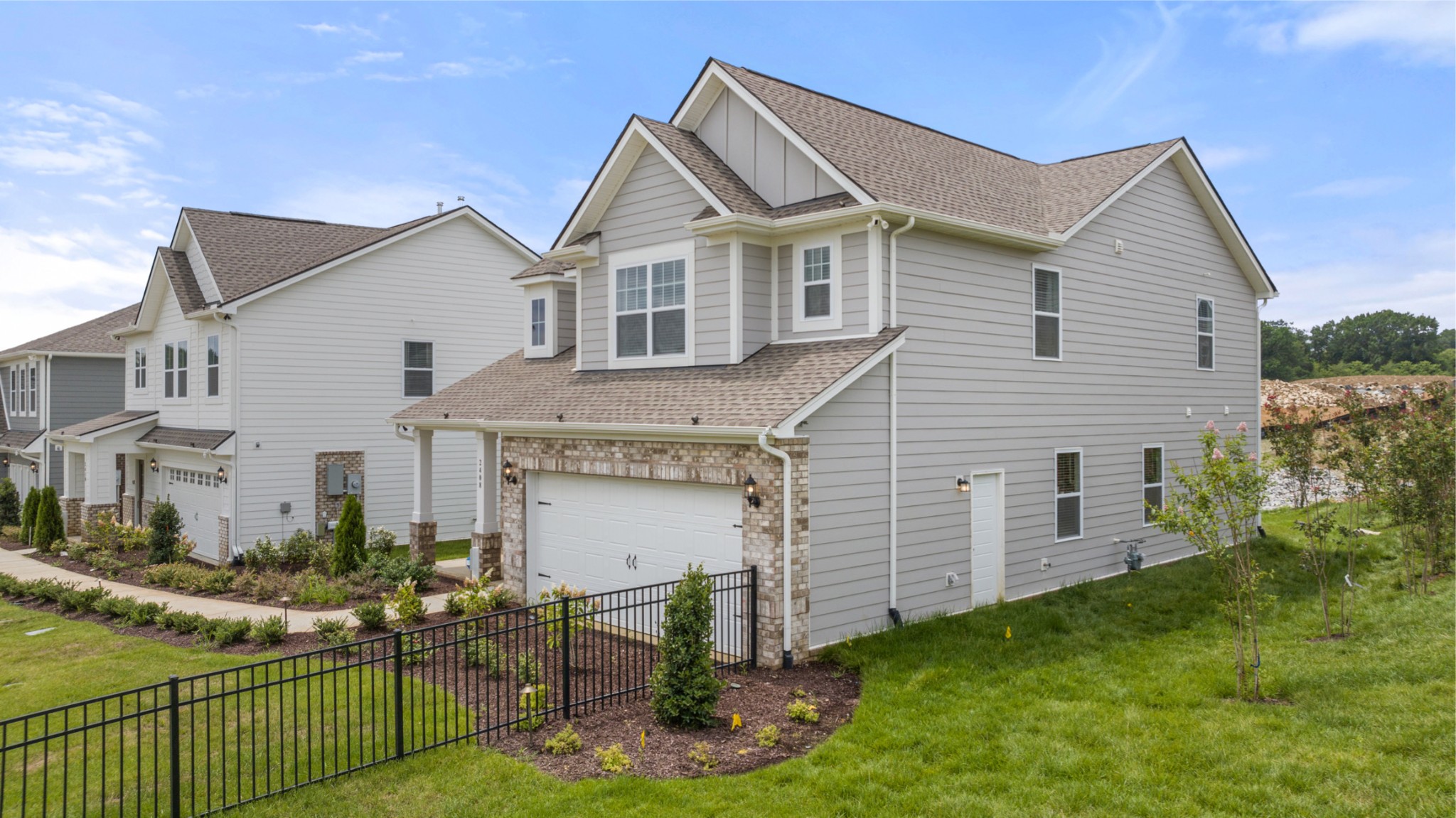 2408 Williams Rdg Drive Columbia, TN 38401 - Photo 44 of 44 a view of a white house next to a yard with plants and chairs