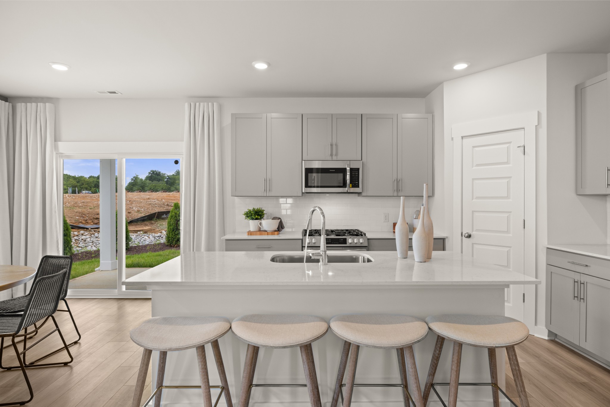 2408 Williams Rdg Drive Columbia, TN 38401 - Photo 8 of 44 a kitchen with stainless steel appliances kitchen island granite countertop a stove a sink and a white cabinets