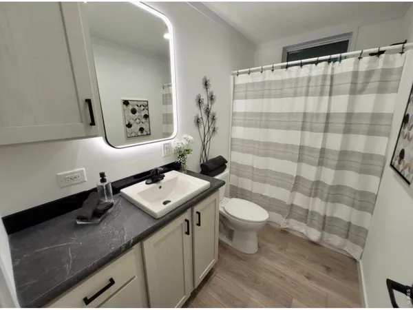a kitchen with a sink and a stove top oven