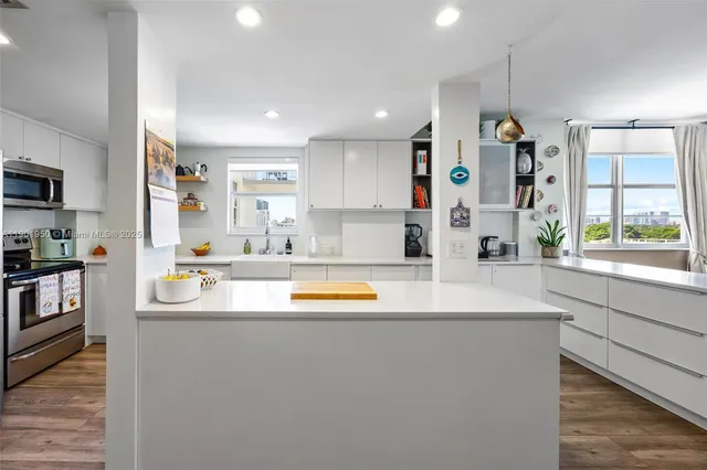 a dining room with furniture window and wooden floor