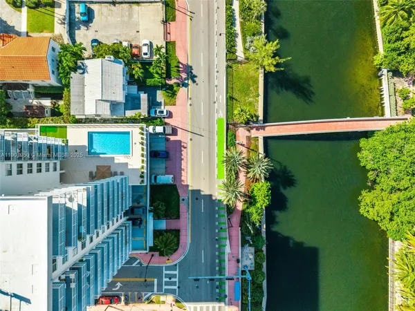 a view of houses with yard and lake view