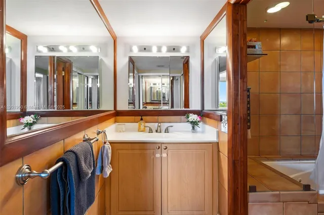 a bathroom with a toilet a sink and a mirror