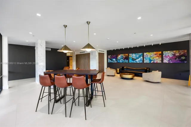 a view of a livingroom with workspace and a couch