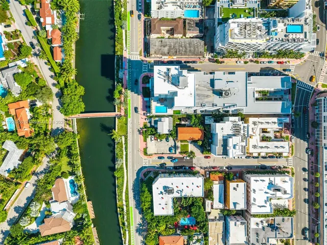 a kitchen with refrigerator and cabinets