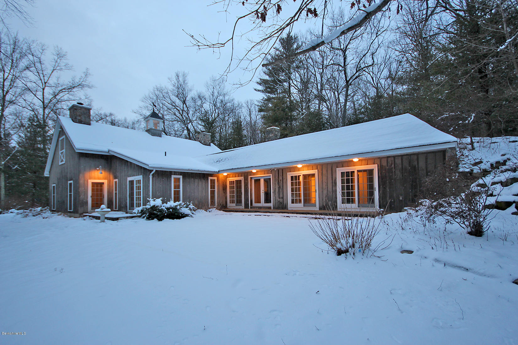 315 Canaan Road Sheffield, MA 01222 - Photo 2 of 40 a front view of a house with a yard and garage