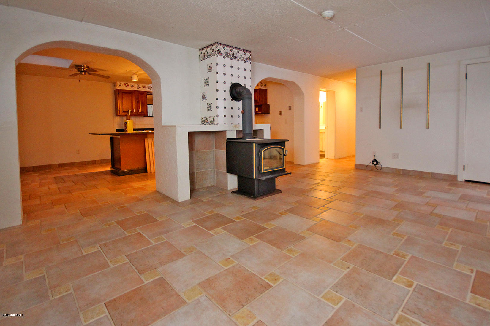 315 Canaan Road Sheffield, MA 01222 - Photo 24 of 40 a view of a kitchen with a sink and a fireplace in it