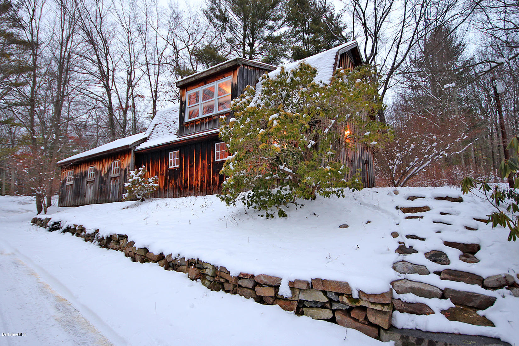 315 Canaan Road Sheffield, MA 01222 - Photo 4 of 40 a view of a house with a yard covered in snow